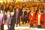 The order of ceremonial requires the audience to stand while the Procession, consisting of staff members and guests, enters the ceremonial ground